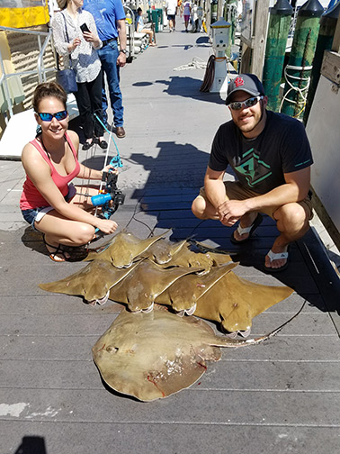 family after a bowfishing trip